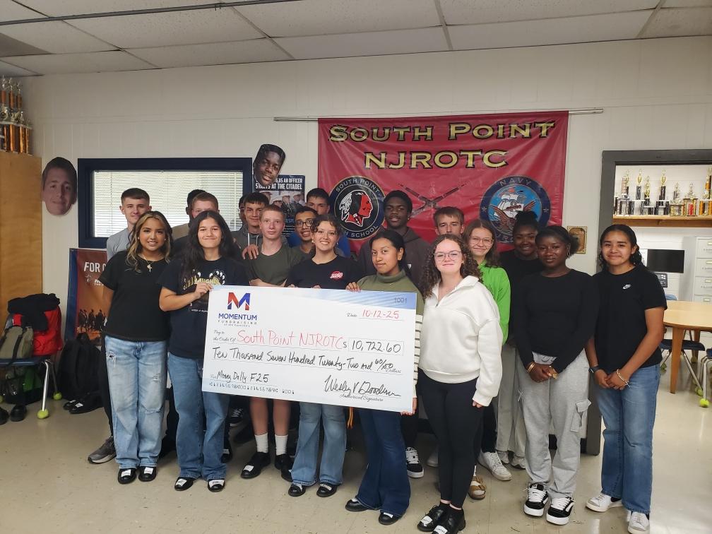 cadets with money dolly check from fundraiser